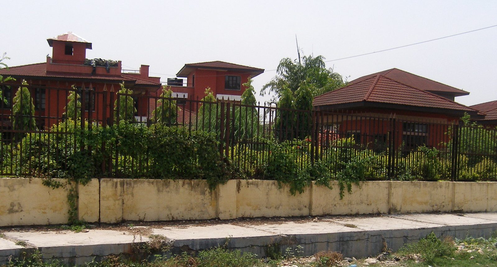 A cream-colored building complex with Nepal Rastra Bank signage, seen in Janakpur, Nepal.
