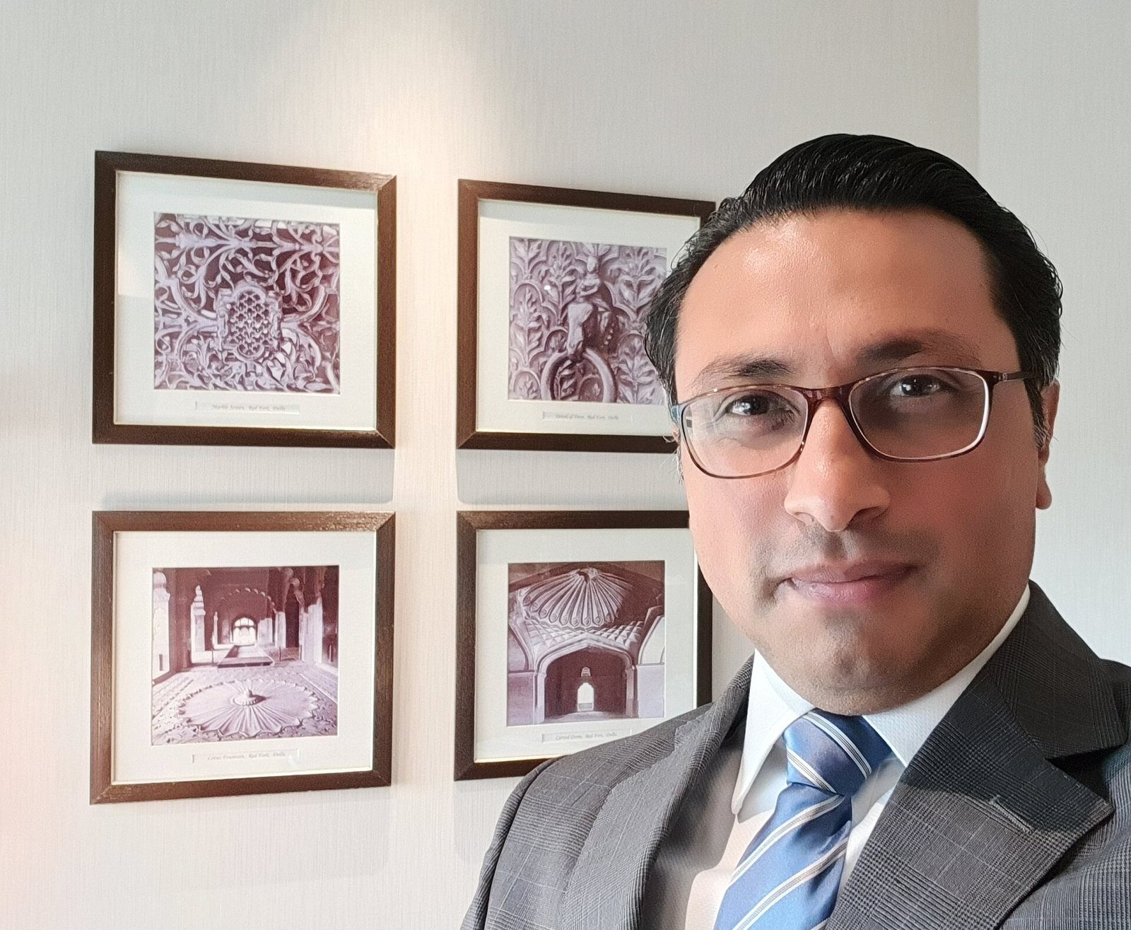 Finance Minister Swarnim Wagle, wearing glasses and a blue tie, in a clear portrait-style photo.